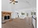 Spacious living area with stone fireplace, modern kitchen, and large windows at 19 Bridgemill Dr, Douglasville, GA 30134
