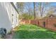 Fenced in grassy back yard surrounded by a brick wall at 228 Mount Vernon Dr, Decatur, GA 30030