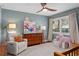 Cozy bedroom with comfy furniture and light blue wallpaper at 228 Mount Vernon Dr, Decatur, GA 30030