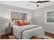 This bedroom features neutral wallpaper, a ceiling fan, and hardwood floors at 228 Mount Vernon Dr, Decatur, GA 30030
