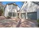 Two-story home featuring a 3-car garage, neutral exterior, and manicured front yard with mature trees at 228 Mount Vernon Dr, Decatur, GA 30030