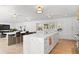 Open-concept kitchen featuring marble countertops, a large island, and sleek modern design at 228 Mount Vernon Dr, Decatur, GA 30030