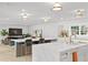Bright and airy open kitchen featuring two islands, marble countertops, and adjacent living area at 228 Mount Vernon Dr, Decatur, GA 30030