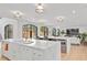 Open kitchen with marble countertops, modern fixtures, and windows overlooking a patio at 228 Mount Vernon Dr, Decatur, GA 30030