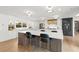 Modern kitchen featuring marble countertops, a large island, and sleek, dark bar stools at 228 Mount Vernon Dr, Decatur, GA 30030