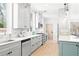 Charming kitchen featuring gray cabinets, marble backsplash, stainless steel appliances and light wood floors at 228 Mount Vernon Dr, Decatur, GA 30030