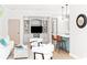 Bright living room with a built-in entertainment center, white sofas, and access to the kitchen area at 228 Mount Vernon Dr, Decatur, GA 30030