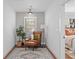 This cozy reading nook features a comfy armchair and a beautiful rug at 228 Mount Vernon Dr, Decatur, GA 30030