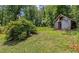 Scenic backyard featuring an old barn and lush trees, offering a peaceful and rustic outdoor retreat at 315 Renae, Marietta, GA 30060