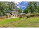 Lush backyard featuring a patio, sunroom, and swing set, providing ample space for relaxation and recreation at 315 Renae, Marietta, GA 30060
