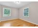 This bedroom features hardwood floors, neutral paint, and sunny windows at 315 Renae, Marietta, GA 30060
