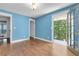 This bedroom features light-blue walls and a door leading to a balcony at 315 Renae, Marietta, GA 30060