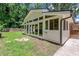 Exterior view of the sunroom with lots of windows and adjacent fenced-in yard and porch area at 315 Renae, Marietta, GA 30060