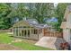 Rear exterior view of the home with a sunroom and an adjacent fenced-in porch area at 315 Renae, Marietta, GA 30060