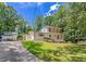 A well-manicured lawn and mature trees complement this two-story house with a detached garage at 315 Renae, Marietta, GA 30060