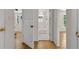 Hallway view into another room with hardwood flooring and white trim throughout the interior at 315 Renae, Marietta, GA 30060