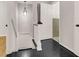 Hallway and stairs leading to a bathroom with light green wall tiles at 315 Renae, Marietta, GA 30060