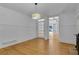 Bright living room featuring hardwood floors, white walls, and an elegant light fixture at 315 Renae, Marietta, GA 30060
