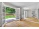 Bright room with hardwood floors, glass paneled doors, and views of the yard at 315 Renae, Marietta, GA 30060