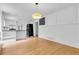 Spacious living area with hardwood floors, an open view of the kitchen, and white wall details at 315 Renae, Marietta, GA 30060