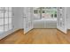 Sunlit interior view showcasing hardwood floors, and views to the yard through open French doors at 315 Renae, Marietta, GA 30060