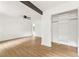 Bedroom with wood-look floors, white walls, and a spacious closet at 4103 Brenda Dr, Decatur, GA 30035