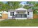 Newly renovated single-story home with black trim, fresh lawn, and covered entry at 4103 Brenda Dr, Decatur, GA 30035