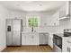 Modern kitchen features stainless steel appliances, white cabinets, and a sleek design with ample counter space at 4103 Brenda Dr, Decatur, GA 30035
