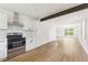 Bright, open kitchen with stainless steel appliances, white cabinets, and modern finishes, flowing into the living area at 4103 Brenda Dr, Decatur, GA 30035