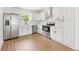 Bright, modern kitchen featuring stainless steel appliances, sleek white cabinetry, and a spacious layout at 4103 Brenda Dr, Decatur, GA 30035