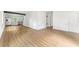 Expansive living area showcasing modern flooring, leading into a contemporary kitchen and dining space at 4103 Brenda Dr, Decatur, GA 30035