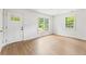 Bright, spacious living room featuring wood-look floors, white walls, and lots of natural light at 4103 Brenda Dr, Decatur, GA 30035