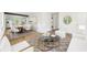 Open-concept living room with dining area, stylish decor, and modern finishes at 4103 Brenda Dr, Decatur, GA 30035