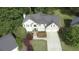 Aerial view of a home with a two-car garage and landscaped grounds at 4314 Woodhaven Se Way, Smyrna, GA 30082