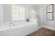 Bathroom featuring a standalone tub, and a glass-enclosed shower at 4314 Woodhaven Se Way, Smyrna, GA 30082