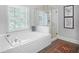 Bathroom featuring a standalone tub, and a glass-enclosed shower at 4314 Woodhaven Se Way, Smyrna, GA 30082