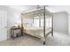 Bedroom featuring a four-poster bed, and a dark wood side table at 4314 Woodhaven Se Way, Smyrna, GA 30082