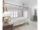 Bedroom featuring a four-poster bed, and a comfortable reading chair at 4314 Woodhaven Se Way, Smyrna, GA 30082