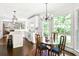 Bright dining area with hardwood floors, large windows, and chandelier lighting fixture at 4314 Woodhaven Se Way, Smyrna, GA 30082