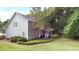 Charming home featuring a screened-in porch and well-manicured lawn at 4314 Woodhaven Se Way, Smyrna, GA 30082