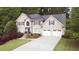 Beautiful two-story home with a two-car garage and manicured lawn at 4314 Woodhaven Se Way, Smyrna, GA 30082