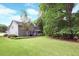 Charming home with a screened-in porch and lush green lawn at 4314 Woodhaven Se Way, Smyrna, GA 30082