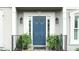 Beautiful front entry door features sidelights, decorative hardware, and manicured landscaping at 4314 Woodhaven Se Way, Smyrna, GA 30082