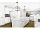Spacious kitchen with white cabinets, large center island, and stainless-steel appliances at 4314 Woodhaven Se Way, Smyrna, GA 30082