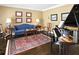 Comfortable living room with beautiful hardwood flooring, a piano and decorative rug and furnishings at 4314 Woodhaven Se Way, Smyrna, GA 30082