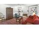 Cozy living room showcasing a fireplace, built-in shelves, and a comfortable seating area with hardwood floors at 4314 Woodhaven Se Way, Smyrna, GA 30082