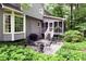 Outdoor patio area with furniture, grill, and view of the home's screened porch at 4314 Woodhaven Se Way, Smyrna, GA 30082