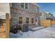 View of backyard patio with snow and new privacy fence installed at 4511 Twinberry Dr, Powder Springs, GA 30127