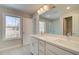 Bright bathroom with dual sink vanity, recessed lighting, and a large window to allow natural light at 4511 Twinberry Dr, Powder Springs, GA 30127