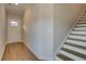 Entryway with light-colored floors next to staircase and front door at 4511 Twinberry Dr, Powder Springs, GA 30127
